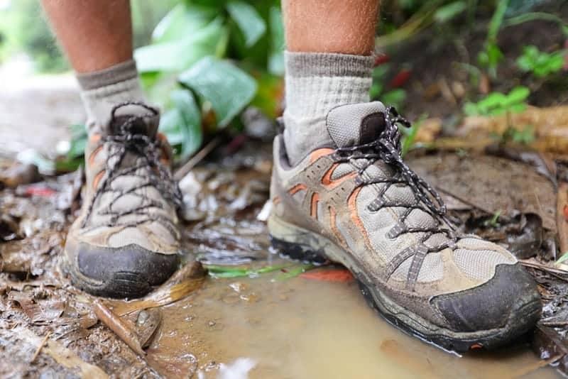 hiking shoes in water puddle
