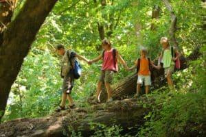 Kids crossing a footbridge on Gatlinburg family vacation