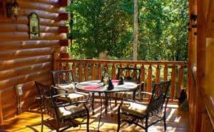 Patio furniture on the deck of a secluded cabin in Gatlinburg.