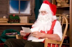 Santa reading mail in his workshop