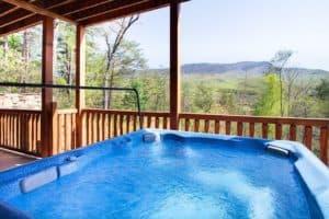 View from the hot tub at Morning Breeze, one of our Gatlinburg TN mountain cabins near a golf course.