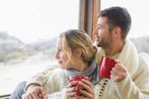 couple enjoying winter view from Gatlinburg log cabin